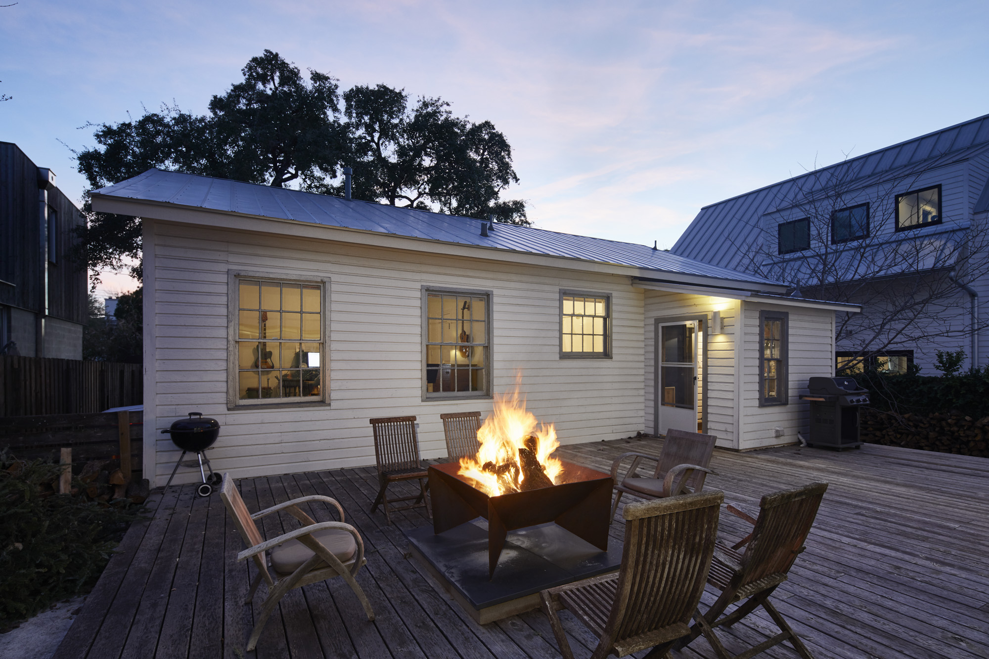 902 West Mary Street, Unit 1 Austin, TX 78704 - Photo 13 of 16 Deck at dusk with a fire pit and area for grilling