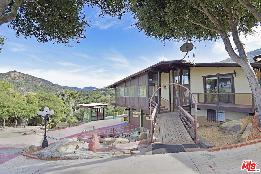 145 Old Church Road Topanga, CA 90290 - Photo 1 of 37 a front view of a house with a yard