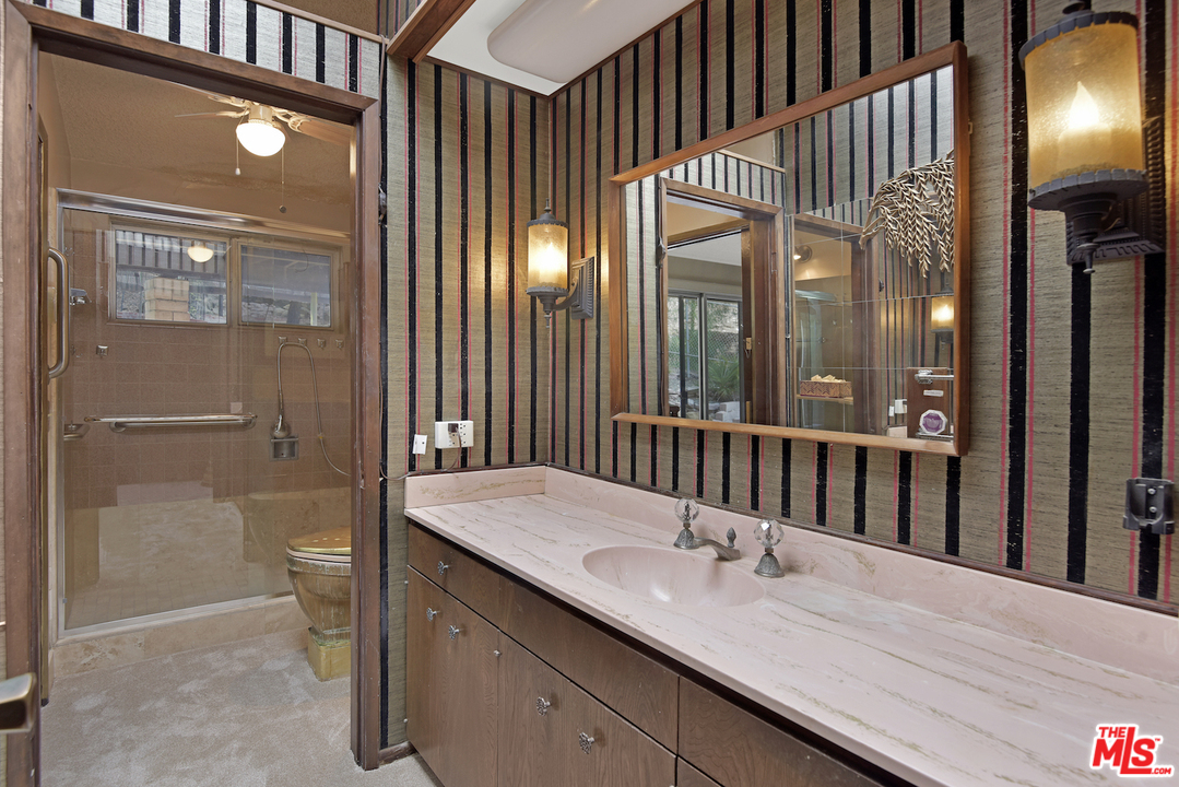 145 Old Church Road Topanga, CA 90290 - Photo 12 of 37 a bathroom with a double vanity sink and a mirror
