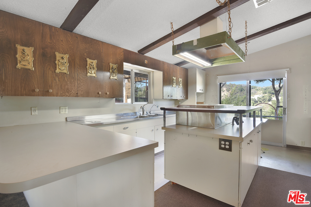 145 Old Church Road Topanga, CA 90290 - Photo 2 of 37 a kitchen with stainless steel appliances granite countertop a sink and a refrigerator
