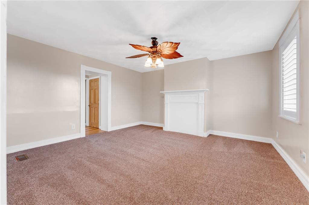 263 Goodwin Road Smithfield, PA 15478 - Photo 41 of 50 a view of a room with a ceiling fan and a window