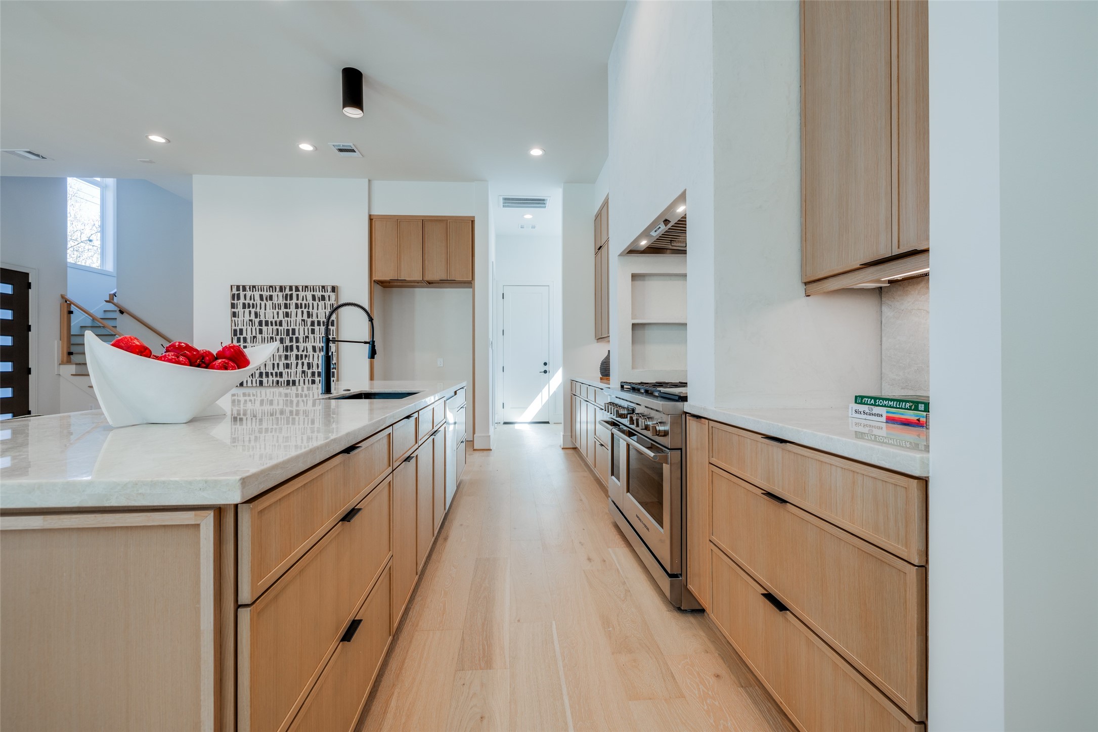 1701 Banks Street Houston, TX 77098 - Photo 17 of 44 a kitchen with stainless steel appliances granite countertop a sink stove and cabinets