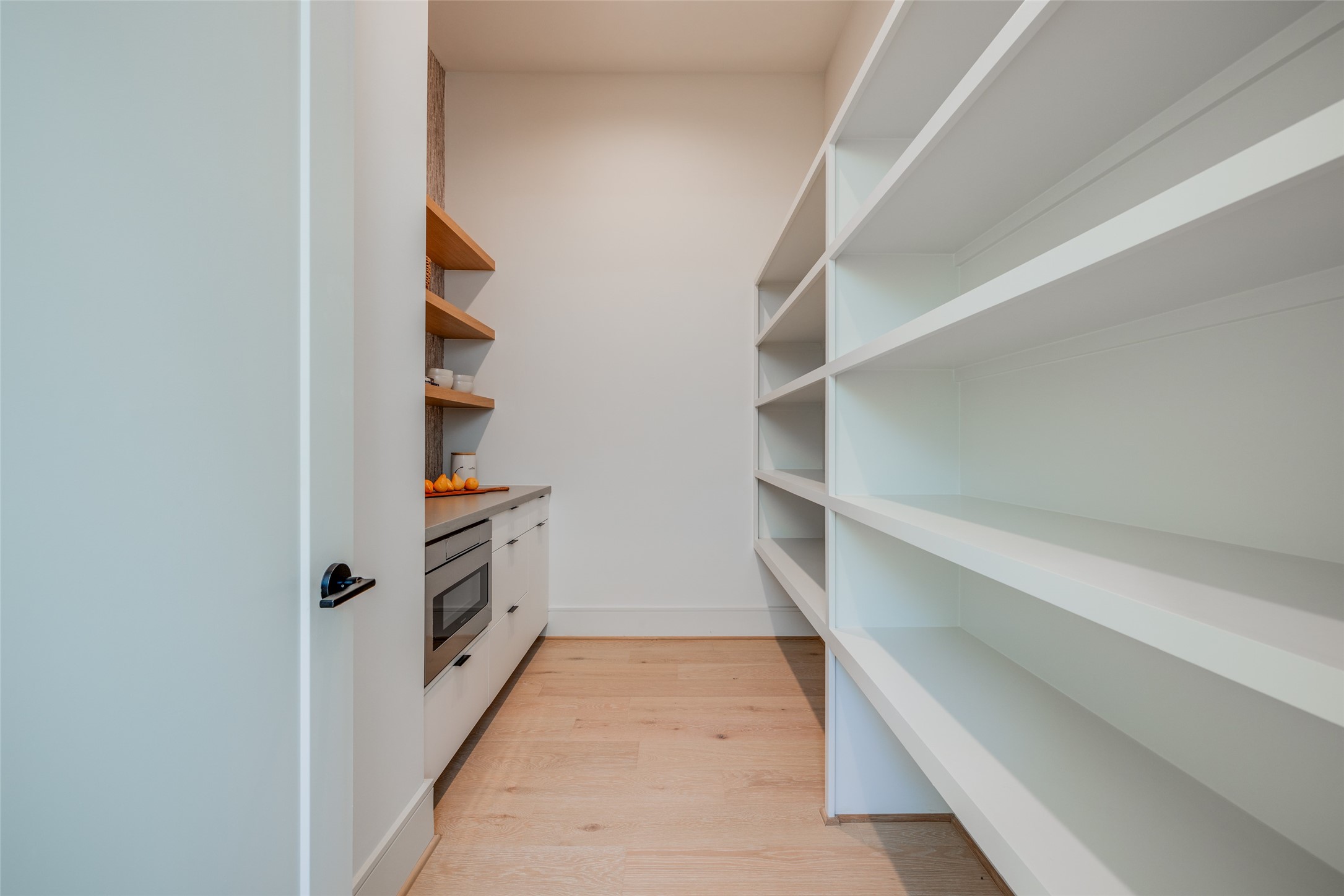 1701 Banks Street Houston, TX 77098 - Photo 22 of 44 a view of walk in closet with empty racks