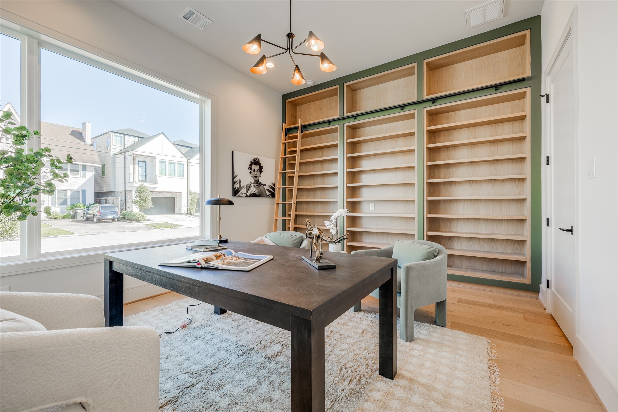 1701 Banks Street Houston, TX 77098 - Photo 26 of 44 a view of a workspace with furniture and a window