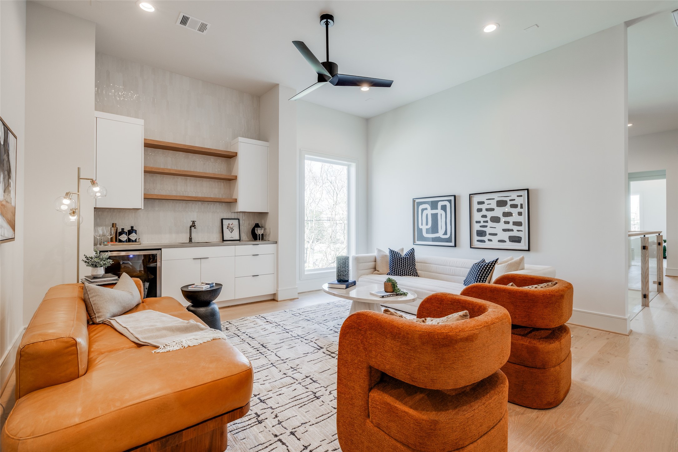 1701 Banks Street Houston, TX 77098 - Photo 27 of 44 a living room with furniture a ceiling fan and a window