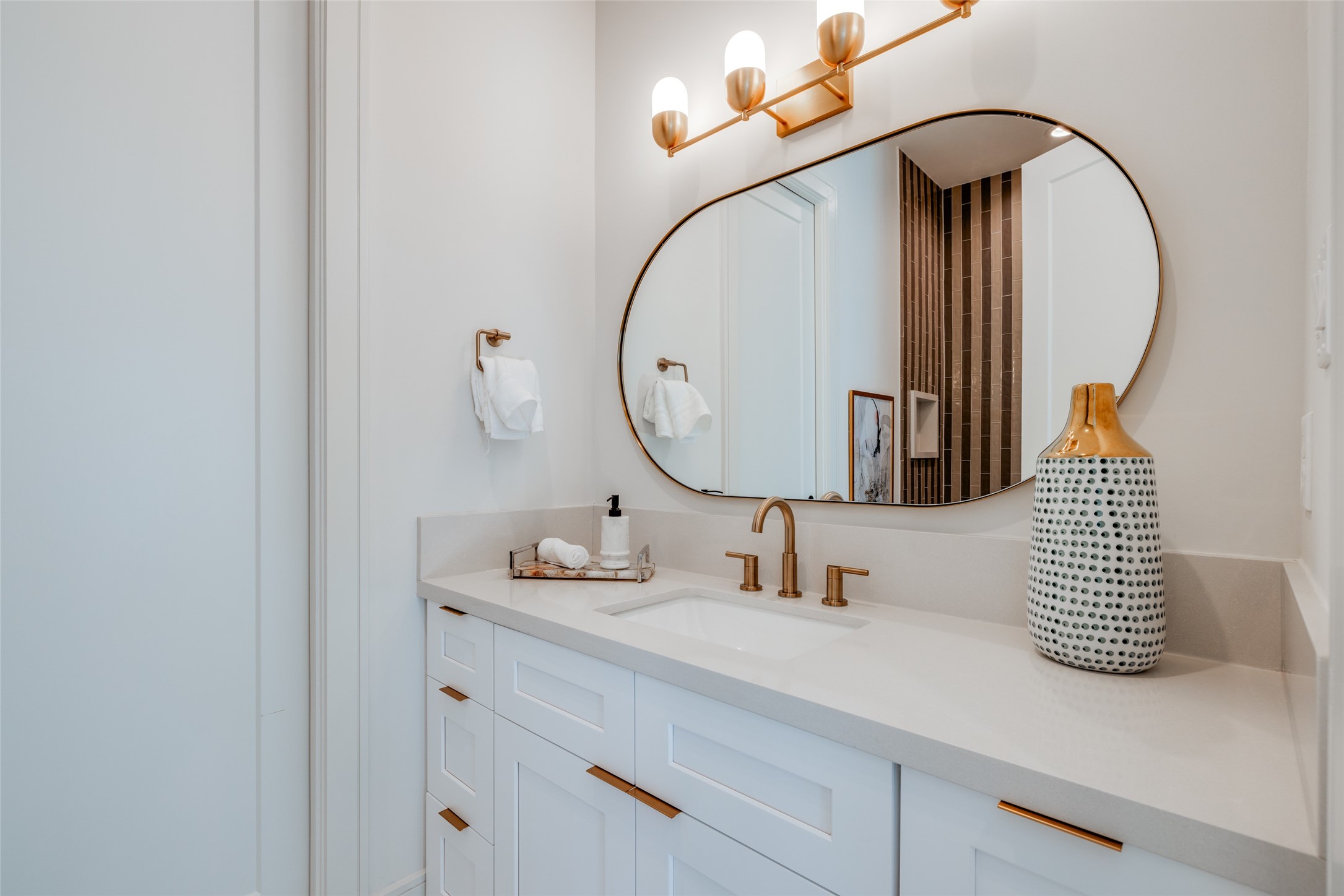 1701 Banks Street Houston, TX 77098 - Photo 30 of 44 a bathroom with a sink and a mirror