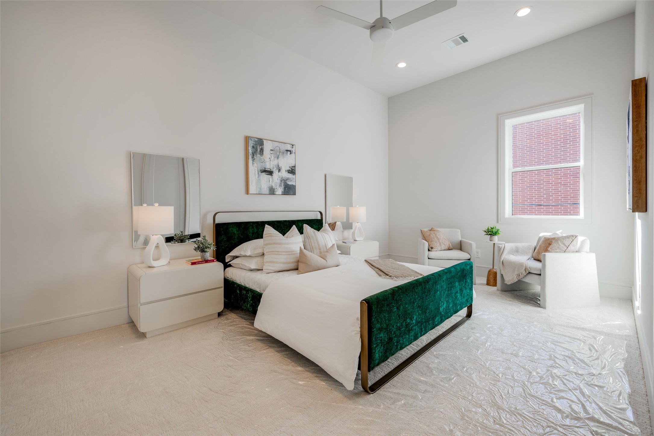 1701 Banks Street Houston, TX 77098 - Photo 33 of 44 a spacious bedroom with a bed and a couch