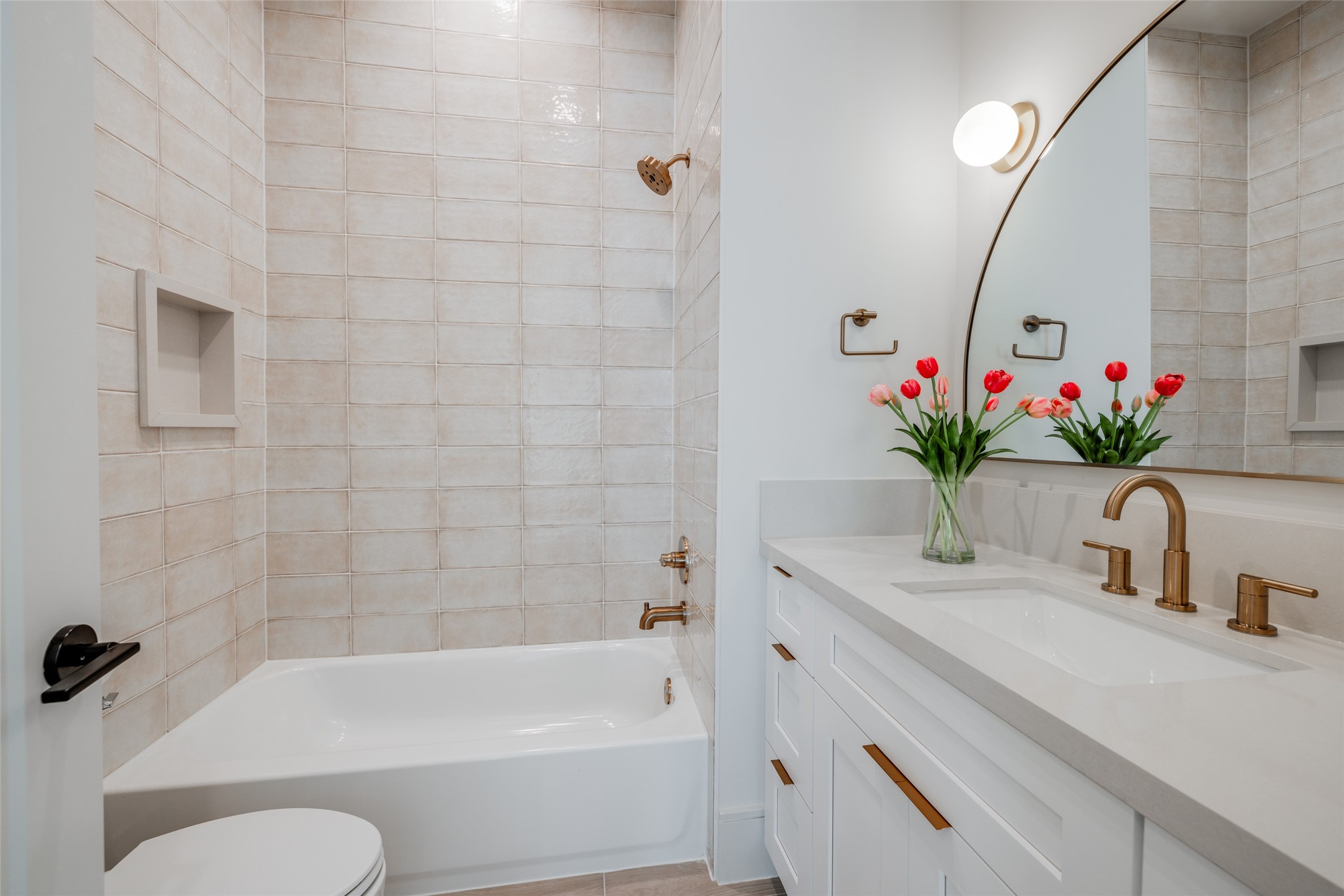 1701 Banks Street Houston, TX 77098 - Photo 34 of 44 a bathroom with a sink a vanity and a tub