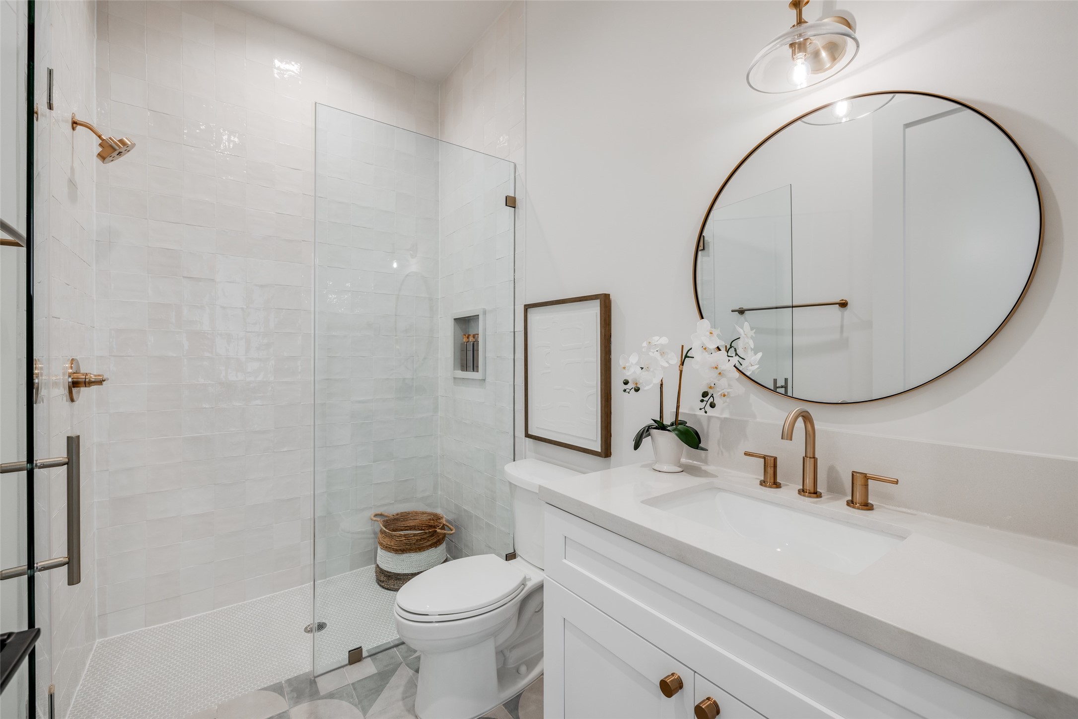 1701 Banks Street Houston, TX 77098 - Photo 36 of 44 a bathroom with a sink a toilet and a mirror