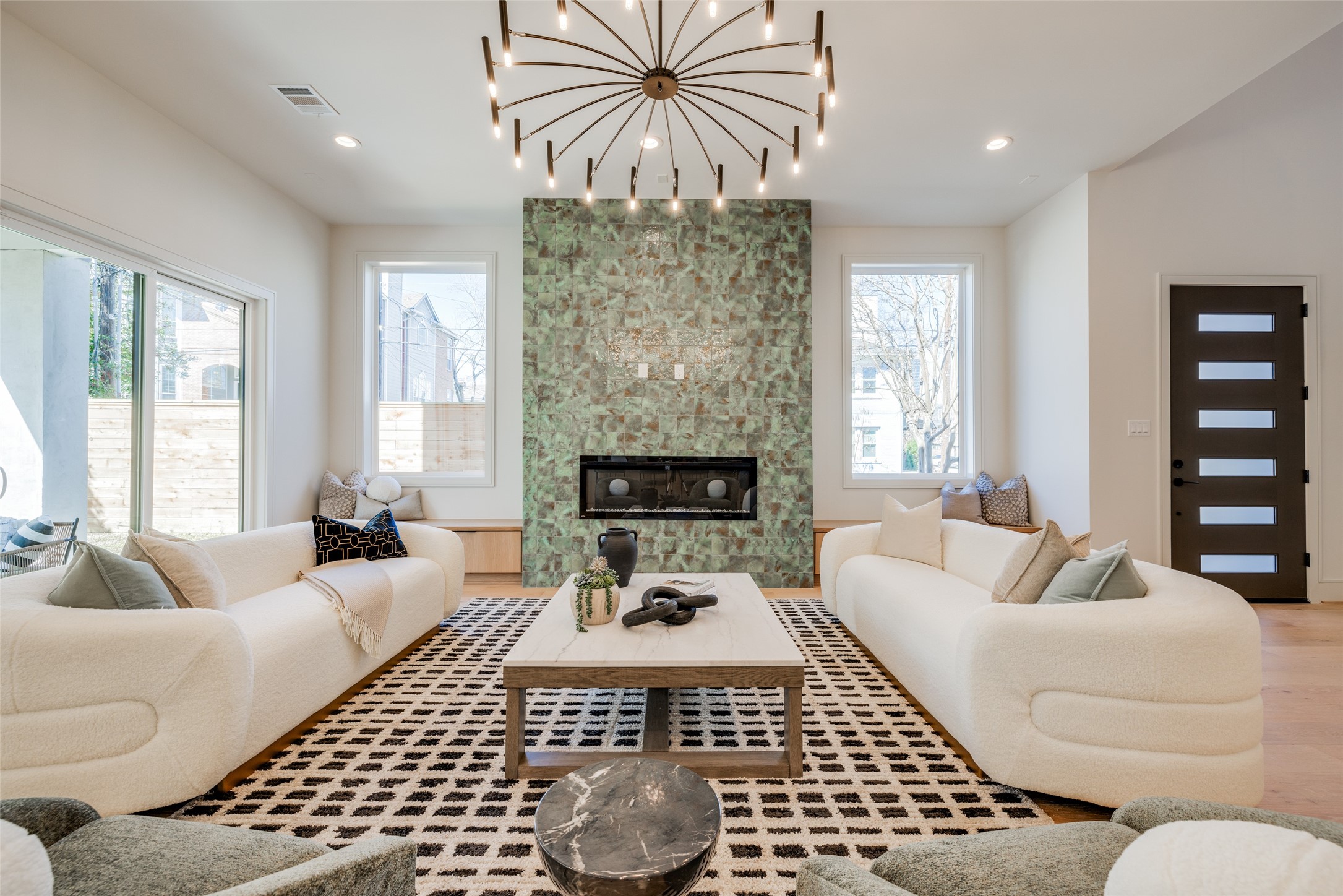 1701 Banks Street Houston, TX 77098 - Photo 11 of 44 a living room with furniture a rug and a chandelier