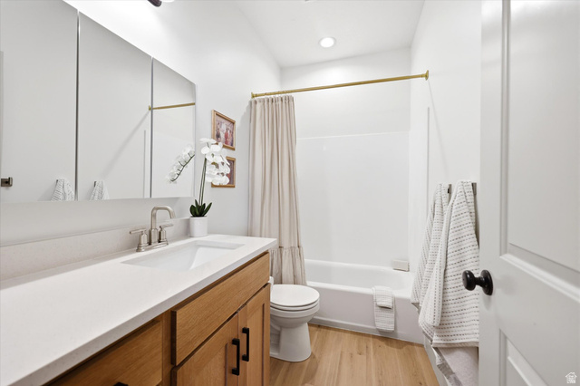 283 North 500 West Mapleton, UT 84664 - Photo 50 of 102 Full bathroom with vanity, shower / bath combination with curtain, and light wood-style flooring.