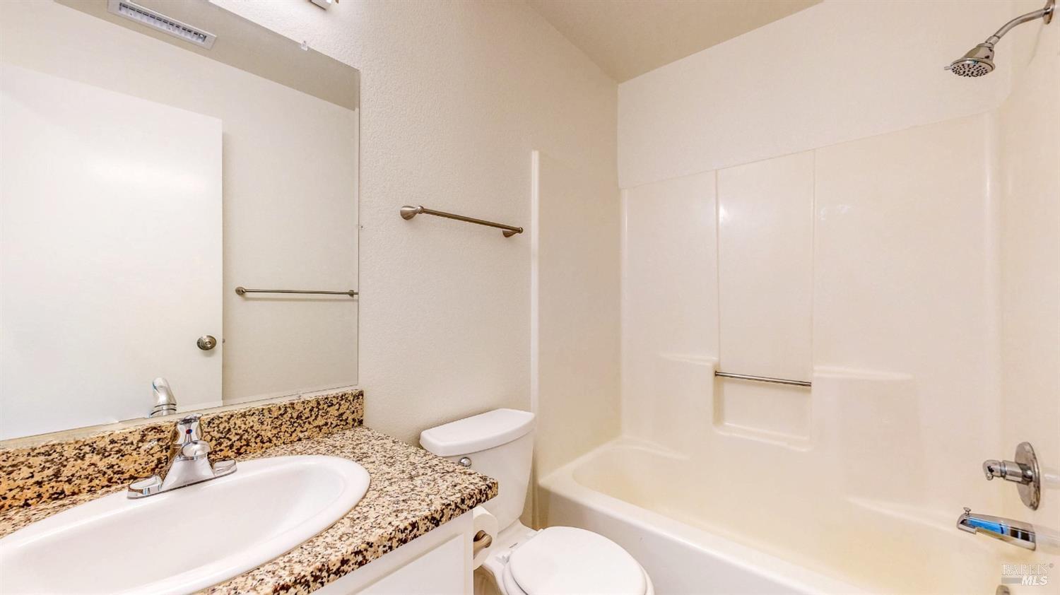 158 North Dutton Avenue Santa Rosa, CA 95401 - Photo 40 of 50 a bathroom with a granite countertop sink toilet and shower
