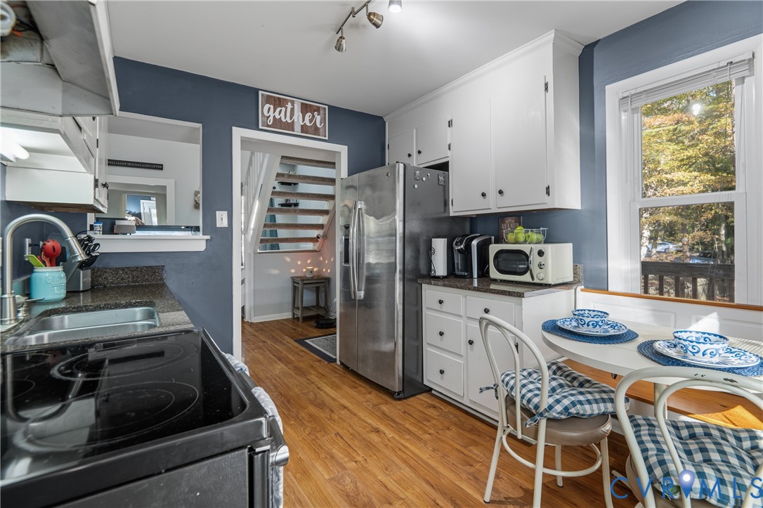 9901 Redbridge Road Chesterfield, VA 23236 - Photo 15 of 42 a kitchen with stainless steel appliances granite countertop a stove and a refrigerator