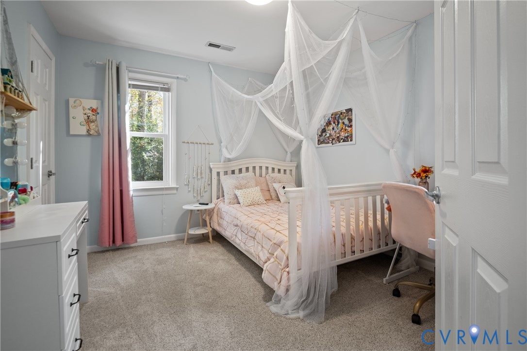 9901 Redbridge Road Chesterfield, VA 23236 - Photo 21 of 42 a bedroom with a bed and a window