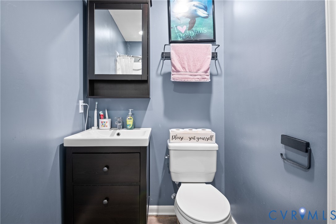 9901 Redbridge Road Chesterfield, VA 23236 - Photo 25 of 42 a bathroom with a toilet sink and mirror