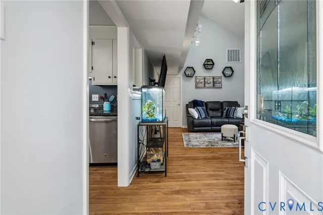 a view of living room with furniture and a rug