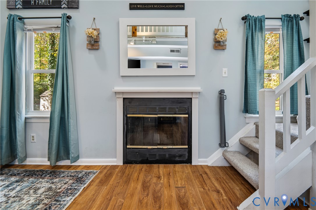 9901 Redbridge Road Chesterfield, VA 23236 - Photo 8 of 42 a living room with a fireplace and a window