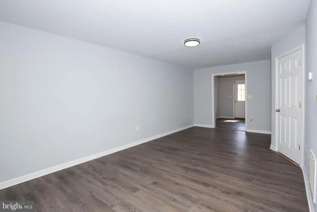 a view of a livingroom with wooden floor