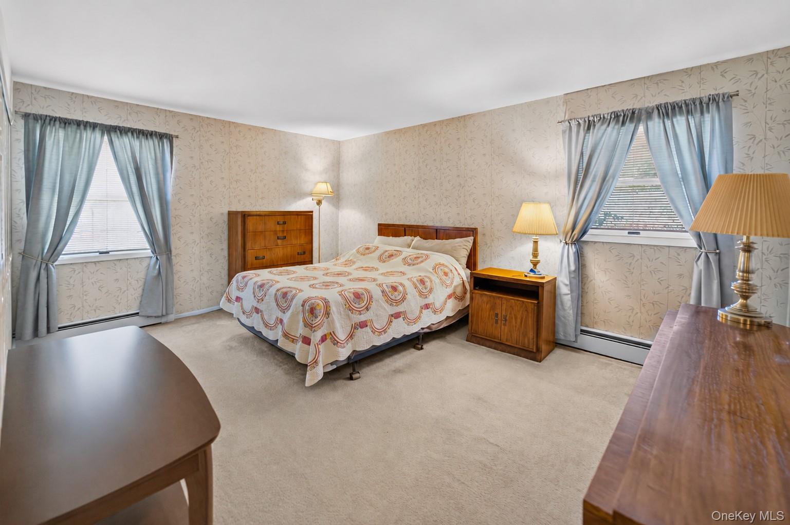 261 Hallock Road Stony Brook, NY 11790 - Photo 7 of 13 a bedroom with a bed and a night stand