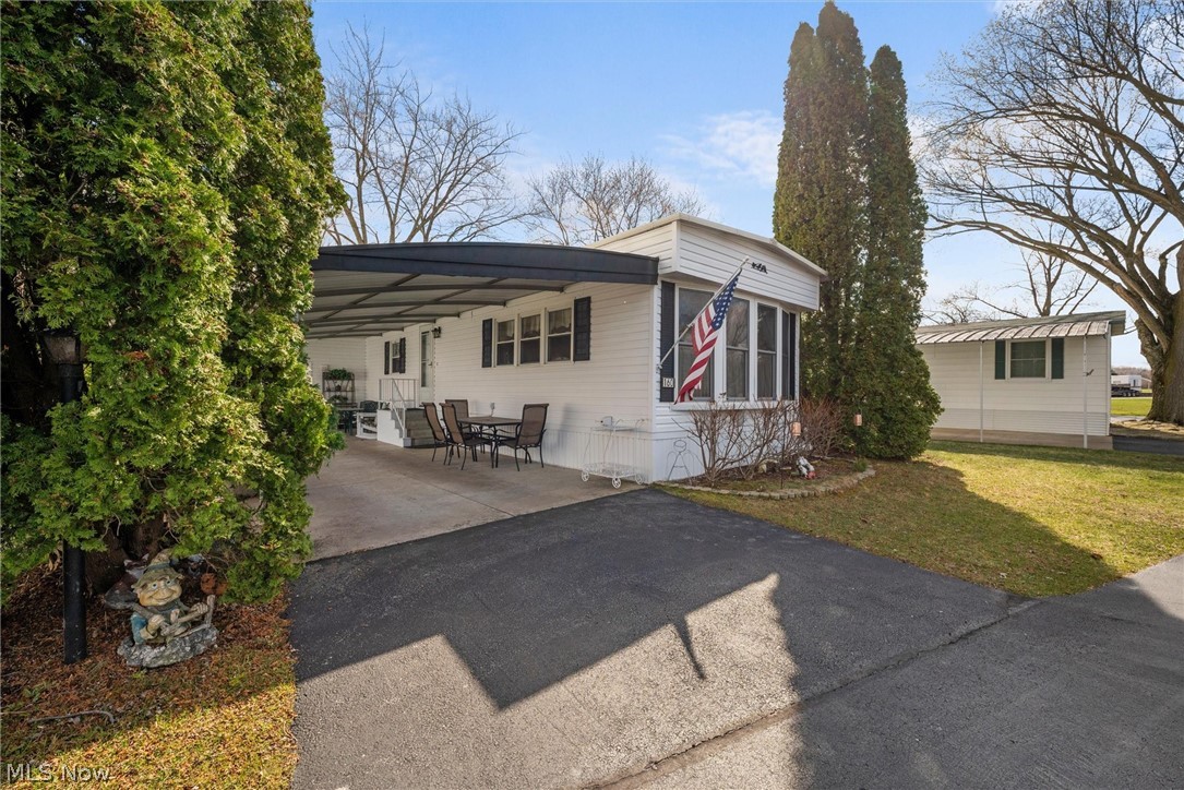 1623 Northeast Catawba Road, Unit 160 Port Clinton, OH 43452 - Photo 2 of 28 Side view with carport