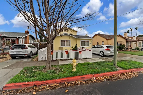 a front view of a house with a yard and table and chairs