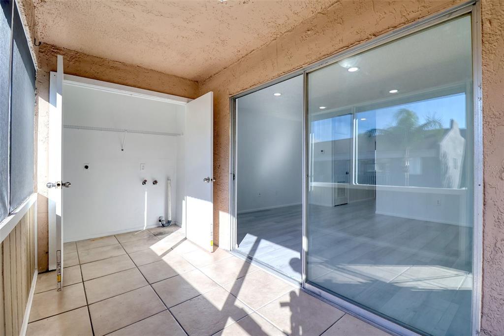 4004 Cortez Drive, Unit D Tampa, FL 33614 - Photo 17 of 30 a bathroom with a glass shower door and a glass door