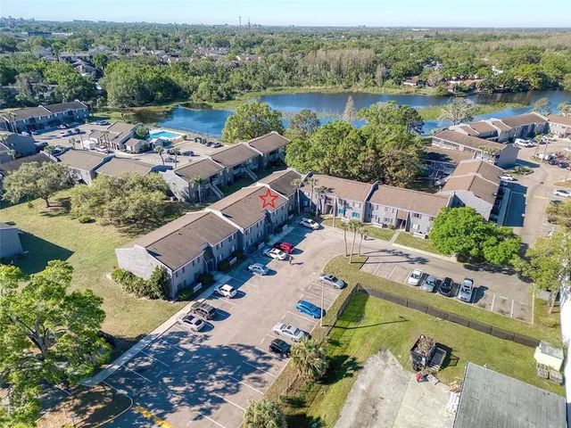 an aerial view of a house with outdoor space