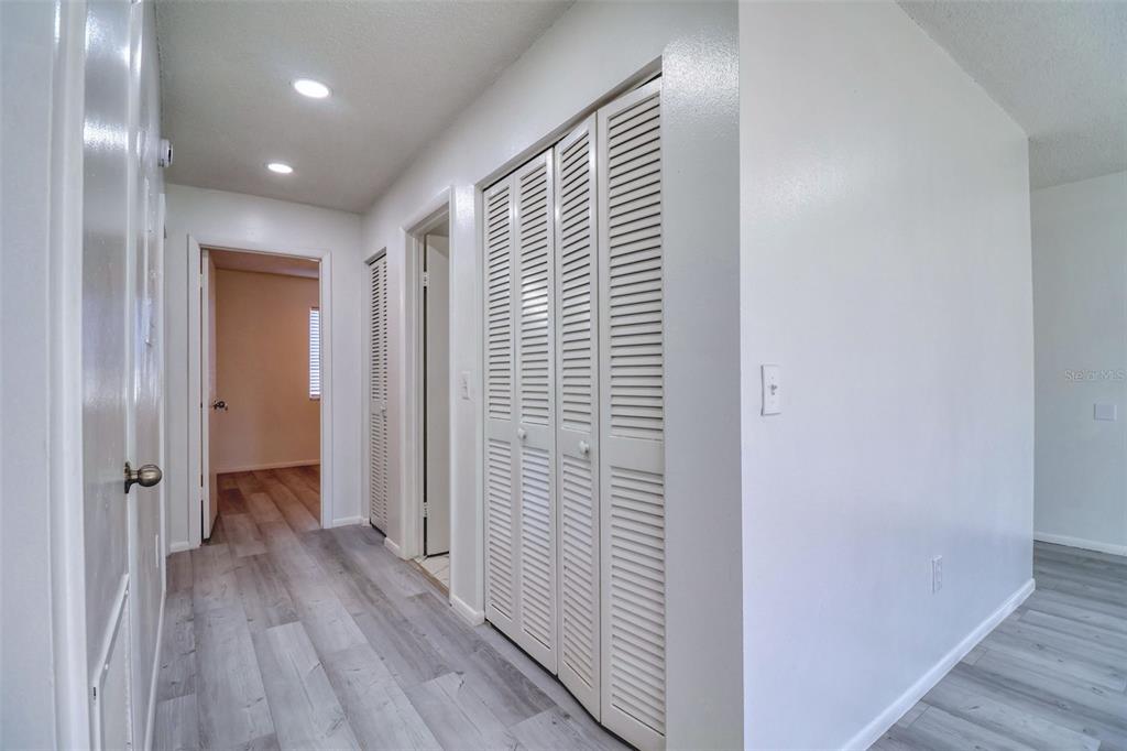 4004 Cortez Drive, Unit D Tampa, FL 33614 - Photo 7 of 30 a view of a hallway with wooden floor