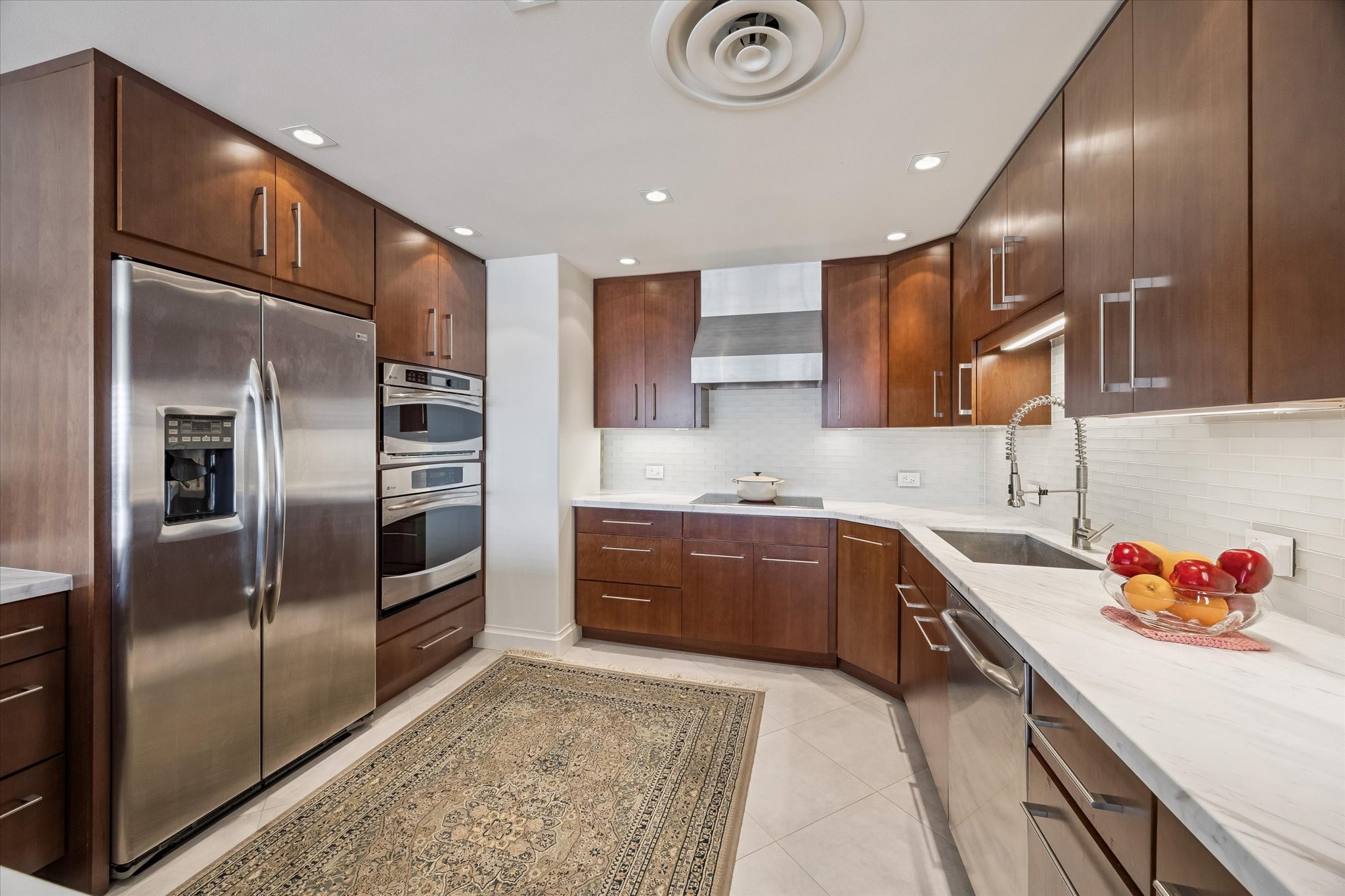 2929 Buffalo Speedway, Unit A1802 Houston, TX 77098 - Photo 11 of 50 a kitchen with granite countertop stainless steel appliances and a sink