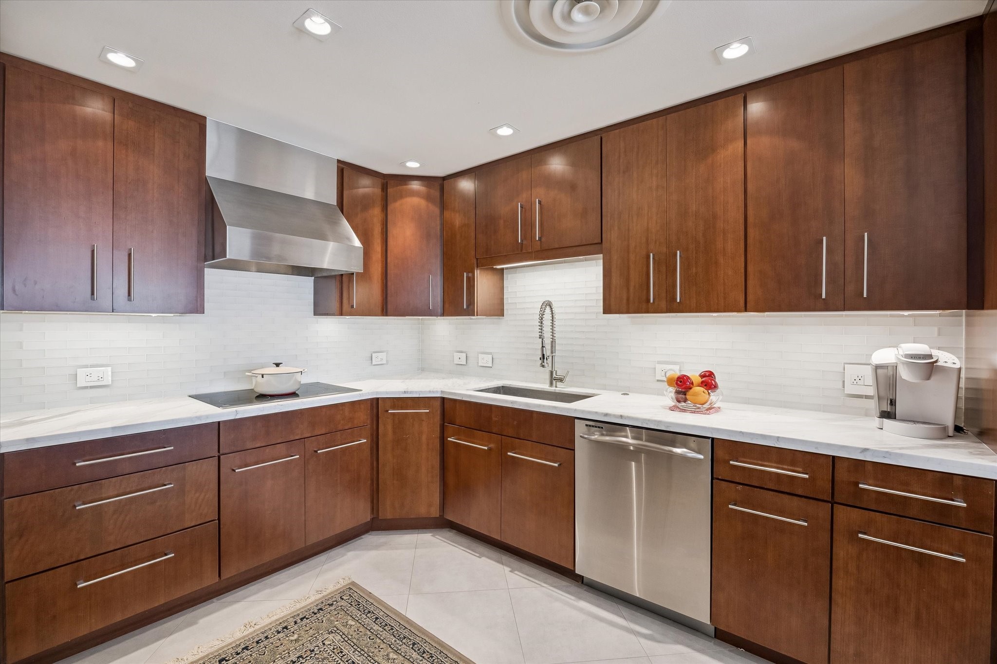2929 Buffalo Speedway, Unit A1802 Houston, TX 77098 - Photo 12 of 50 a kitchen with sink cabinets and window