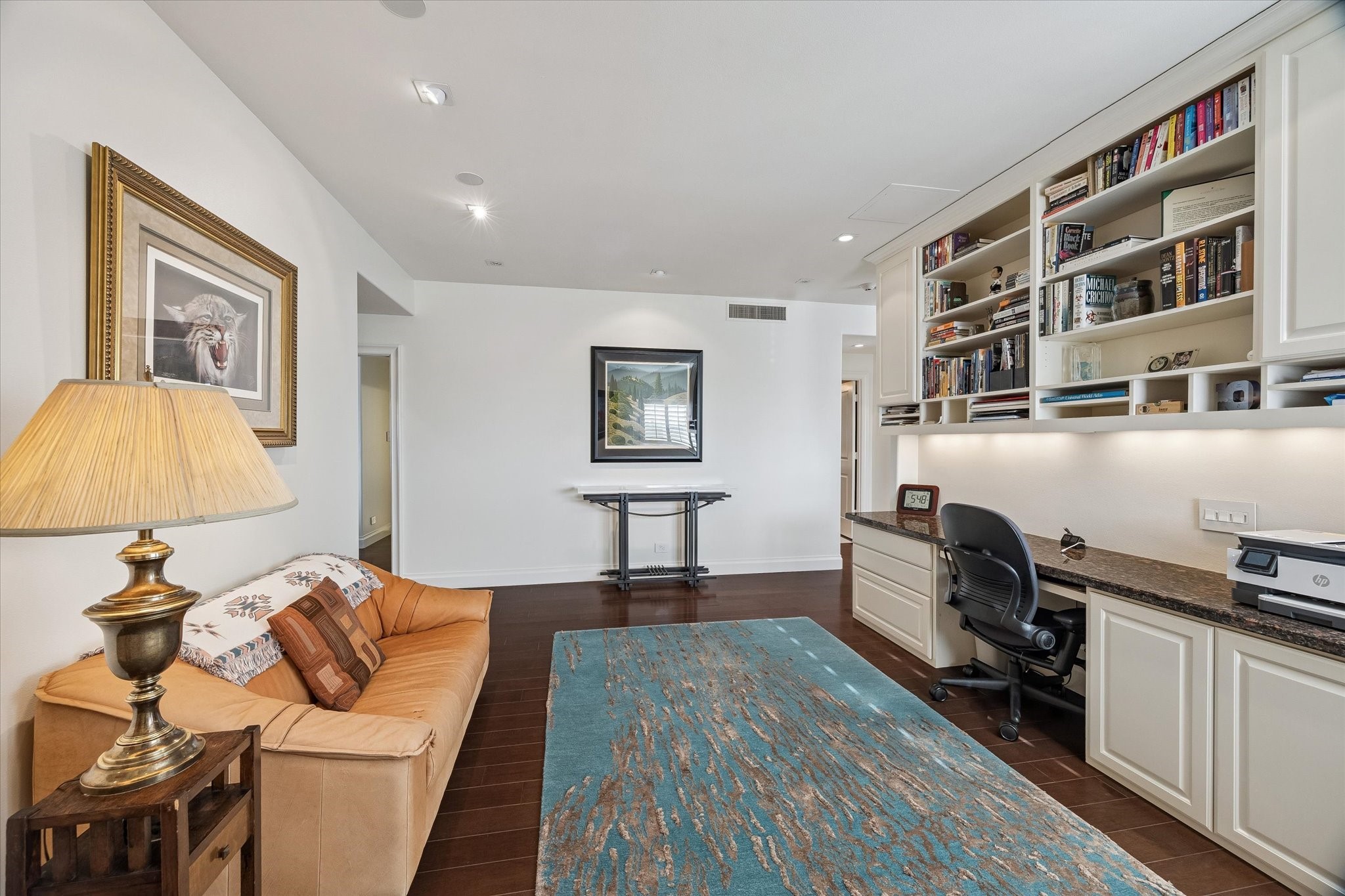 2929 Buffalo Speedway, Unit A1802 Houston, TX 77098 - Photo 14 of 50 a bedroom with a bed and wooden floor