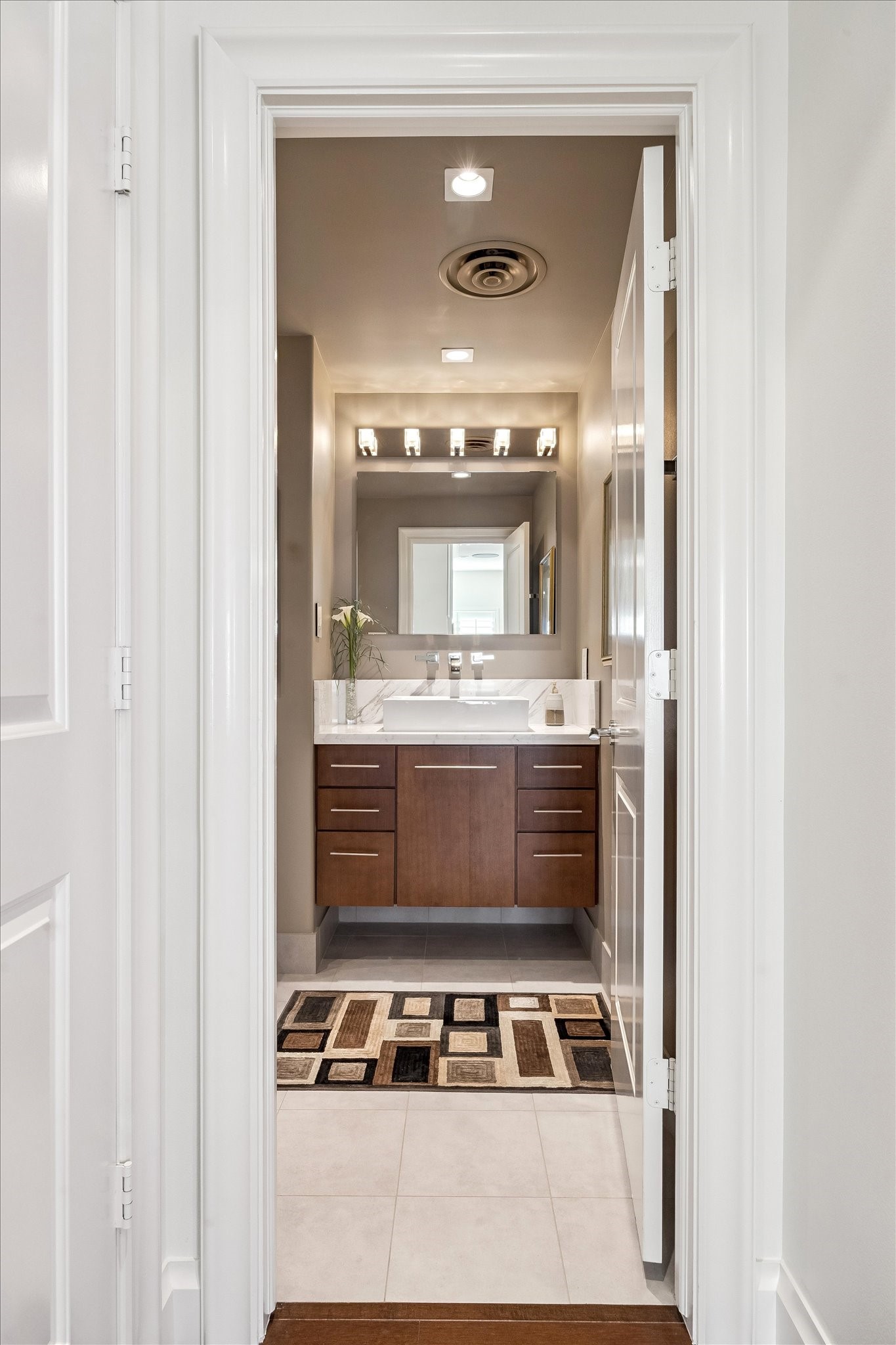 2929 Buffalo Speedway, Unit A1802 Houston, TX 77098 - Photo 15 of 50 a bathroom with a sink and a mirror