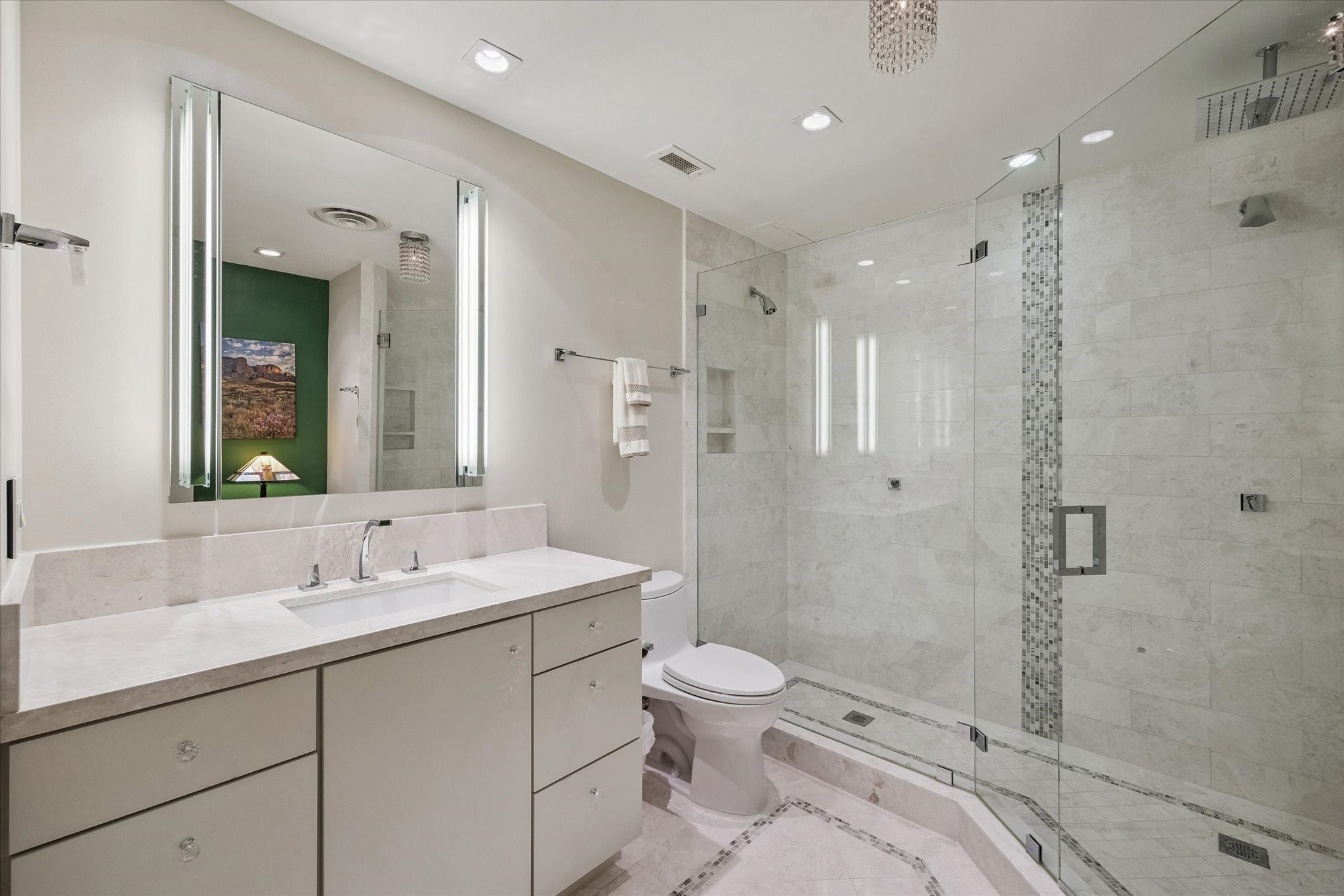 2929 Buffalo Speedway, Unit A1802 Houston, TX 77098 - Photo 20 of 50 a bathroom with a sink a toilet a mirror and shower