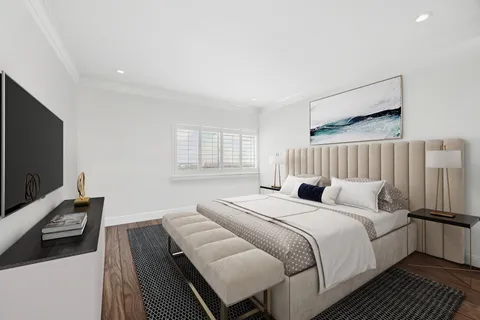 a bedroom with a bed and a flat screen tv