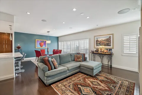 a living room with furniture and a rug