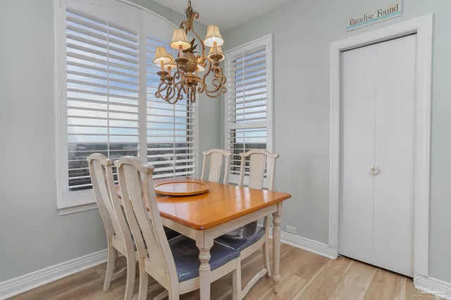 a dining room with furniture and window