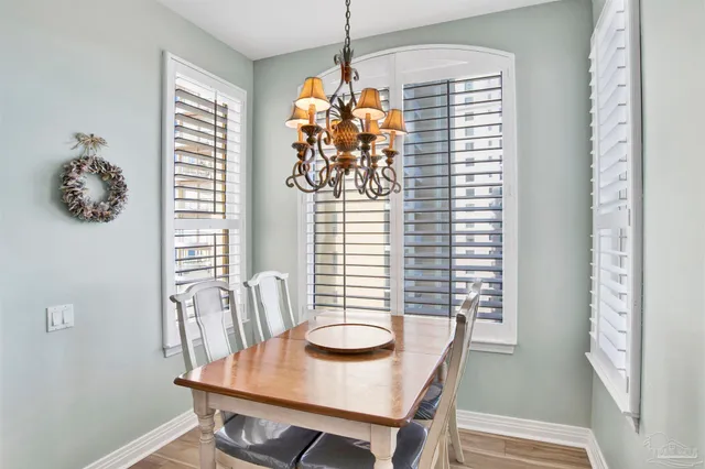 a kitchen with granite countertop white cabinets white appliances and sink