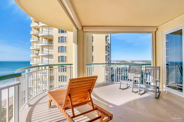 a view of a balcony with wooden floor