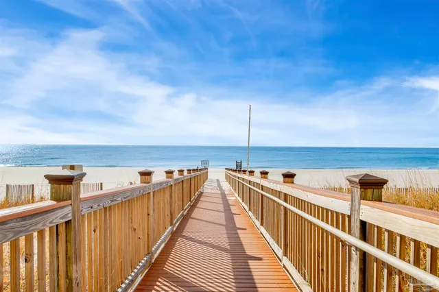 a swimming pool with outdoor seating and yard