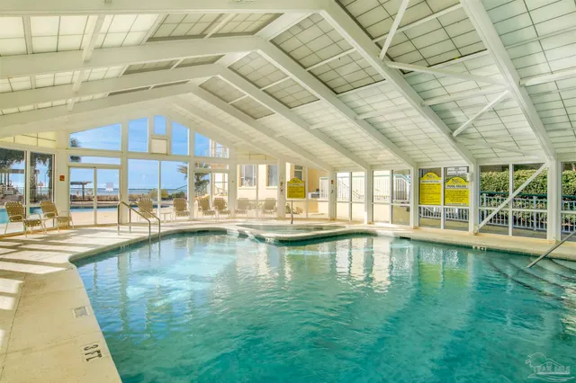 a view of a swimming pool with a lounge chairs