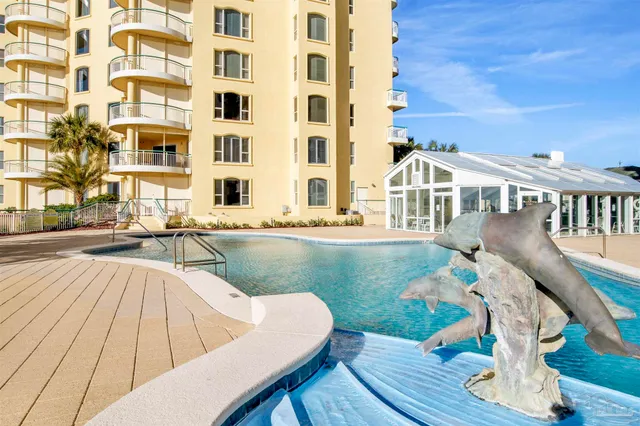 a view of swimming pool with outdoor seating