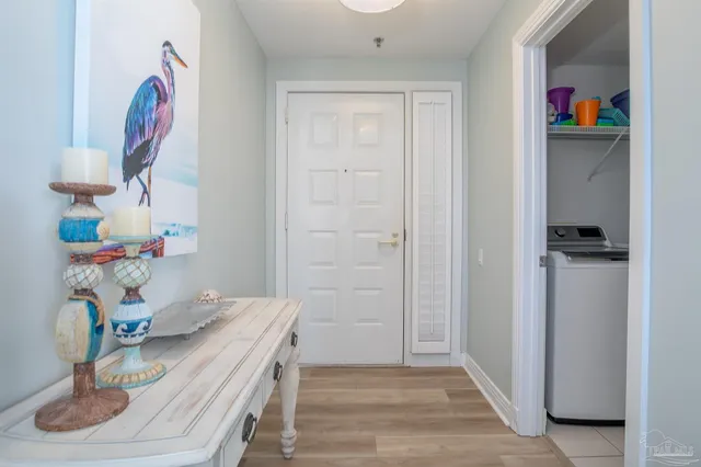 a view of entryway with wooden floor
