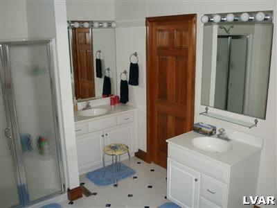 680 Clearfield Road Nazareth, PA 18064 - Photo 19 of 30 a bathroom with a sink toilet a mirror a vanity and shower