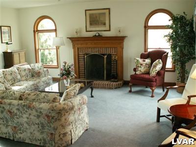 680 Clearfield Road Nazareth, PA 18064 - Photo 20 of 30 a living room with furniture and a fireplace