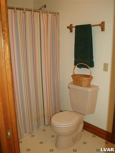 680 Clearfield Road Nazareth, PA 18064 - Photo 25 of 30 a white toilet sitting next to a shower curtain