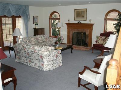 680 Clearfield Road Nazareth, PA 18064 - Photo 5 of 30 a living room with furniture and a fireplace