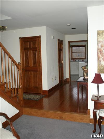 680 Clearfield Road Nazareth, PA 18064 - Photo 7 of 30 a view of a livingroom with furniture and front door