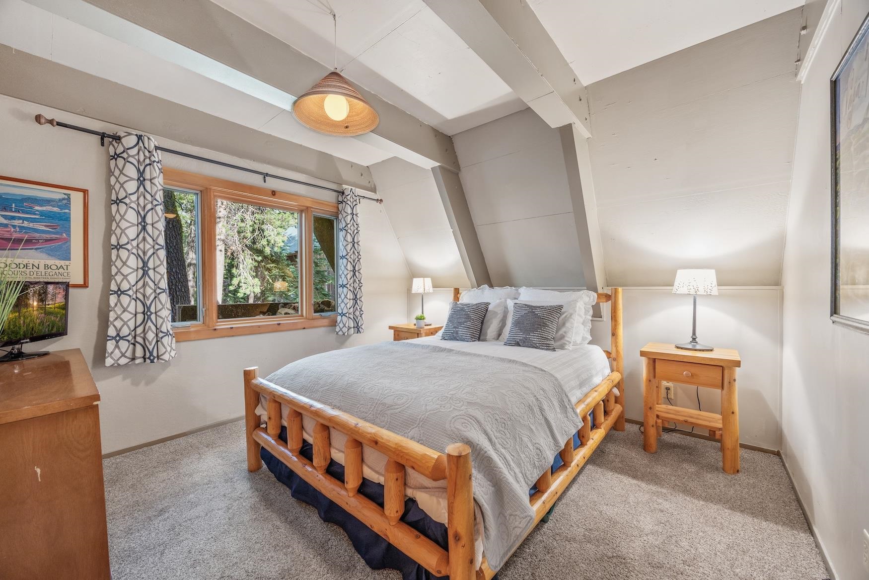 5262 Palisade Road Soda Springs, CA 95728 - Photo 12 of 24 a large bedroom with a bed and window