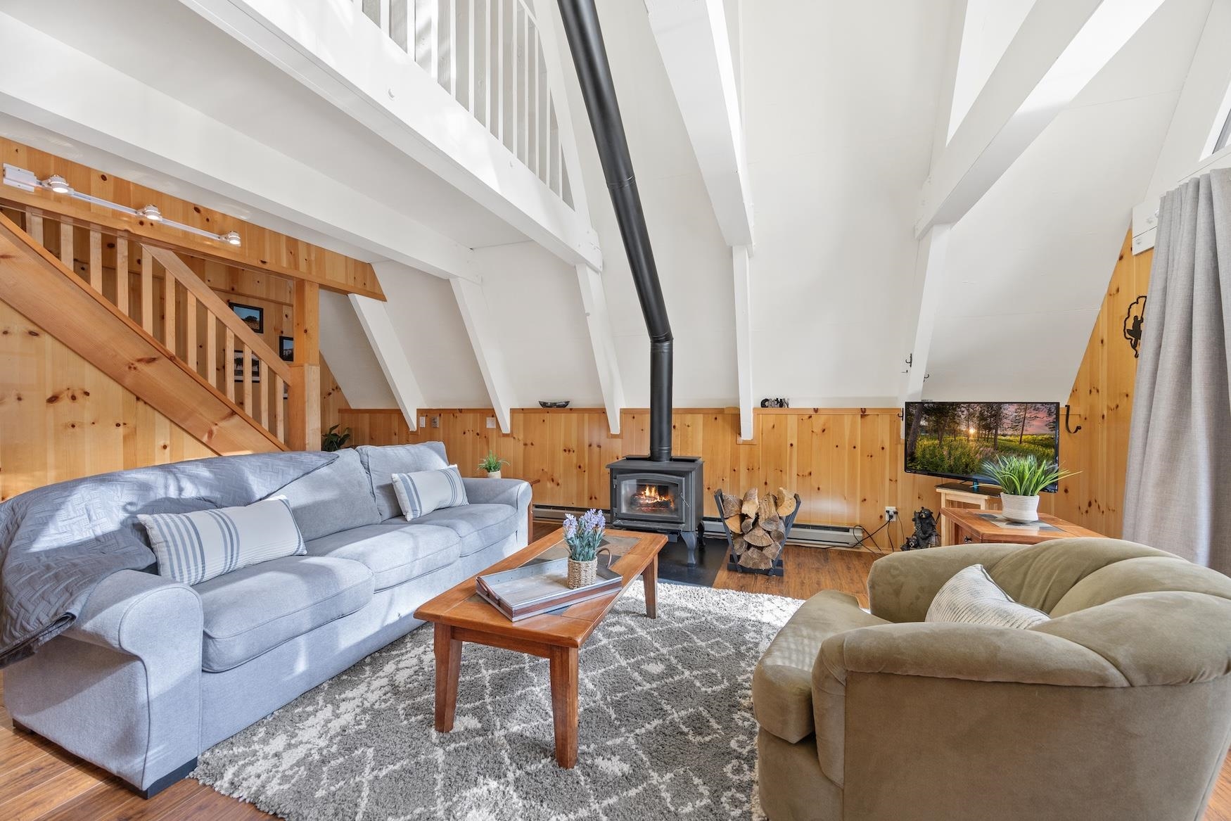 5262 Palisade Road Soda Springs, CA 95728 - Photo 3 of 24 a living room with furniture and a flat screen tv