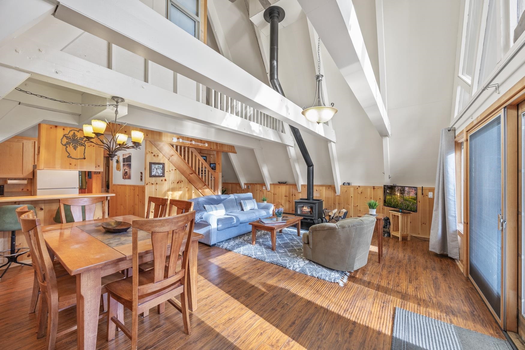 5262 Palisade Road Soda Springs, CA 95728 - Photo 7 of 24 a living room with lots of furniture and a chandelier